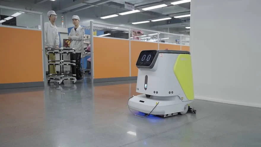 PUDU CC1 cleaning an industrial production floor