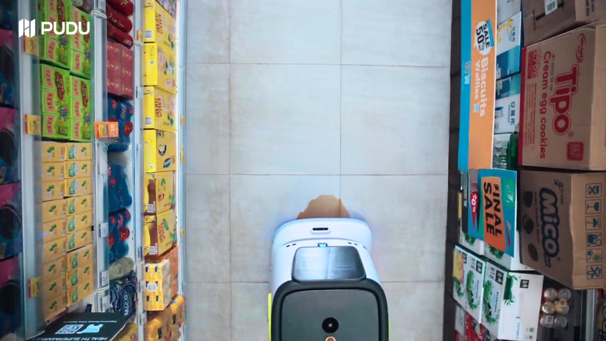 PUDU CC1 cleaning a convenience retail floor